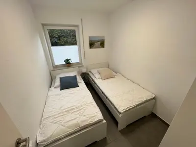 Ein Bett oder Betten in einem Zimmer der Unterkunft Residenz Cux-Havenglück