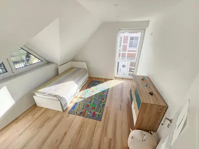 Ein Bett oder Betten in einem Zimmer der Unterkunft Ferienhaus Angerdorf Nr 21