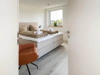 Ein Bett oder Betten in einem Zimmer der Unterkunft Inseltörn Wohnung 10