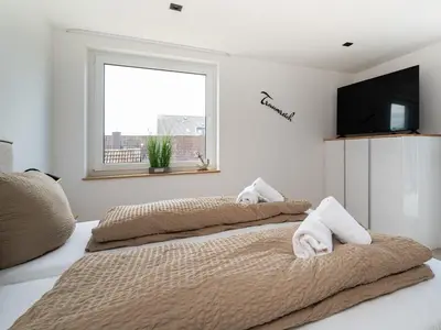 Ein Bett oder Betten in einem Zimmer der Unterkunft Inseltörn Wohnung 10
