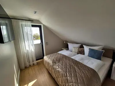 Ein Bett oder Betten in einem Zimmer der Unterkunft Inseltörn Penthouse