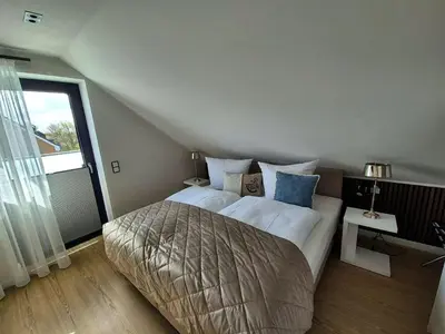 Ein Bett oder Betten in einem Zimmer der Unterkunft Inseltörn Penthouse