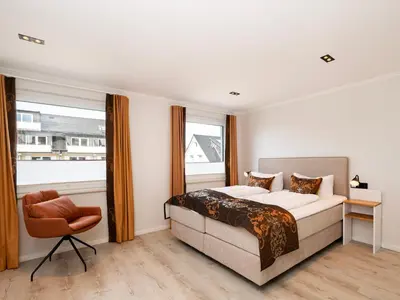 Ein Bett oder Betten in einem Zimmer der Unterkunft Inseltörn Wohnung 5