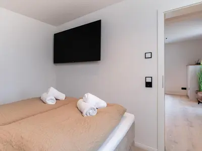 Ein Bett oder Betten in einem Zimmer der Unterkunft Inseltörn Wohnung 12