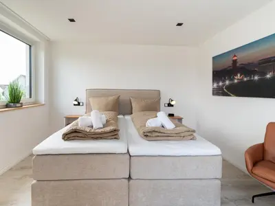 Ein Bett oder Betten in einem Zimmer der Unterkunft Inseltörn Wohnung 11