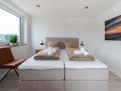 Ein Bett oder Betten in einem Zimmer der Unterkunft Inseltörn Wohnung 9