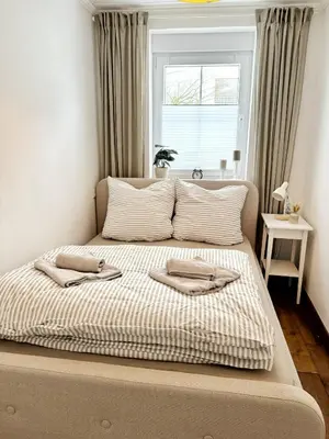 Ein Bett oder Betten in einem Zimmer der Unterkunft Ferienhaus Sandstrand