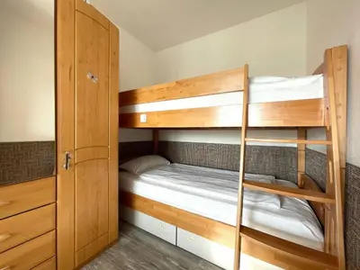 Ein Bett oder Betten in einem Zimmer der Unterkunft Frische Brise FeWo 01.04