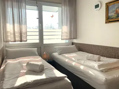 Ein Bett oder Betten in einem Zimmer der Unterkunft Frische Brise FeWo 01.04