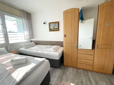 Ein Bett oder Betten in einem Zimmer der Unterkunft Frische Brise FeWo 01.04