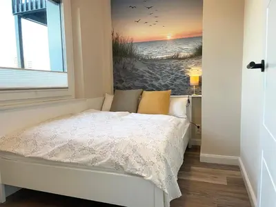 Ein Bett oder Betten in einem Zimmer der Unterkunft Seaside 53° FeWo 5