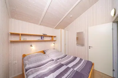 Ein Bett oder Betten in einem Zimmer der Unterkunft Ferienhaus Otter