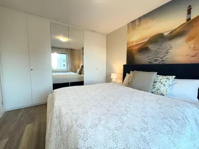 Ein Bett oder Betten in einem Zimmer der Unterkunft Seaside 53 Grad FeWo 5