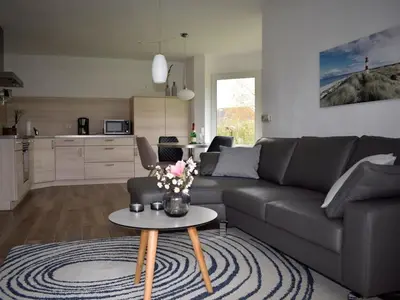 Ein Sitzbereich in der Unterkunft Holiday cottage on the dike Comfortable holiday residence