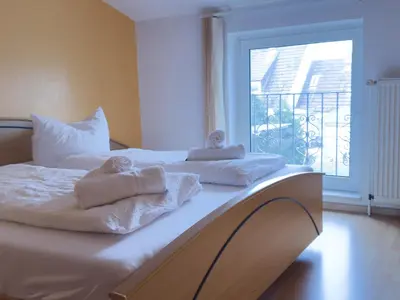 Ein Bett oder Betten in einem Zimmer der Unterkunft Schilingshof WHG 2