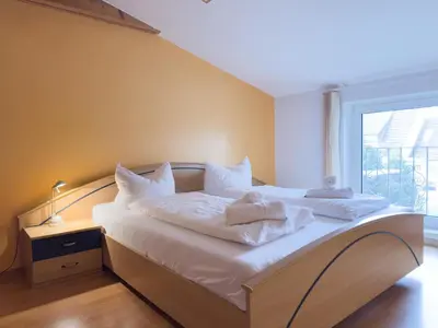 Ein Bett oder Betten in einem Zimmer der Unterkunft Schilingshof WHG 2