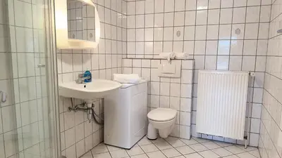 Ein Badezimmer in der Unterkunft Schilingshof WHG 3