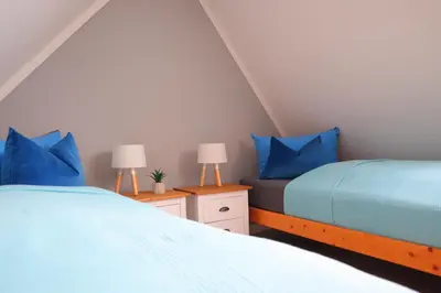 Ein Bett oder Betten in einem Zimmer der Unterkunft Ferienhaus Nordlicht