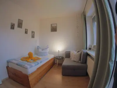 Ein Bett oder Betten in einem Zimmer der Unterkunft KüstenMuschel