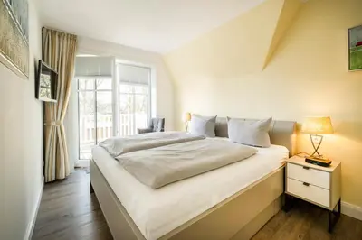 Ein Bett oder Betten in einem Zimmer der Unterkunft Büsumer Reethus Apartment 2 3