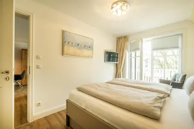 Ein Bett oder Betten in einem Zimmer der Unterkunft Büsumer Reethus Apartment 2 3