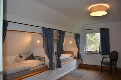 Ein Bett oder Betten in einem Zimmer der Unterkunft Deichkieker