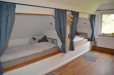 Ein Bett oder Betten in einem Zimmer der Unterkunft Deichkieker