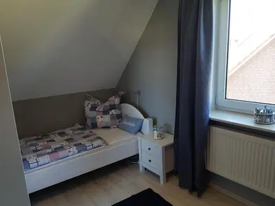 Ein Bett oder Betten in einem Zimmer der Unterkunft Ferienkate am Deich