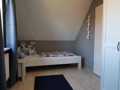 Ein Bett oder Betten in einem Zimmer der Unterkunft Ferienkate am Deich