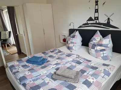 Ein Bett oder Betten in einem Zimmer der Unterkunft Ferienkate am Deich