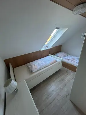 Ein Bett oder Betten in einem Zimmer der Unterkunft Lotus 3
