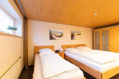 Ein Bett oder Betten in einem Zimmer der Unterkunft Haus Vogelsand, App 301