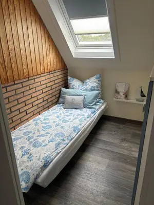 Ein Bett oder Betten in einem Zimmer der Unterkunft Küsten Auszeit