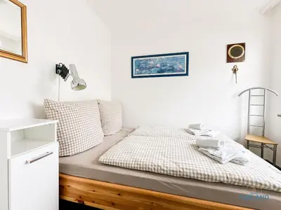Ein Bett oder Betten in einem Zimmer der Unterkunft Duhnenbüdje