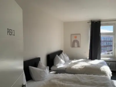 Ein Bett oder Betten in einem Zimmer der Unterkunft Pier 1 bis 4 gmütliche Zimmer mit Boxspringbett