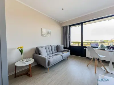 Ein Sitzbereich in der Unterkunft Haus Jan am Strand Wohnung 204