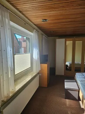 Ein Bett oder Betten in einem Zimmer der Unterkunft Ferienwohnung Alt Otterndorf