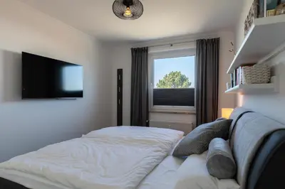 Ein Bett oder Betten in einem Zimmer der Unterkunft Haus Medemsand, Whg 221