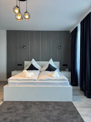 Ein Bett oder Betten in einem Zimmer der Unterkunft Atlantic 003- Exclusive Ferienwohnung mit Pool, Sauna und Fitnessbereich im Haus