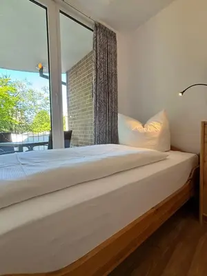 Ein Bett oder Betten in einem Zimmer der Unterkunft Haus Hohe Worth, Apartment 110