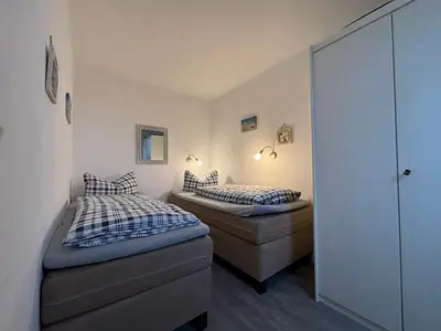 Ein Bett oder Betten in einem Zimmer der Unterkunft Haus Pavillon, Ferienwohnung 13