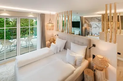 Ein Bett oder Betten in einem Zimmer der Unterkunft Das Oswald's Boutique Hotel