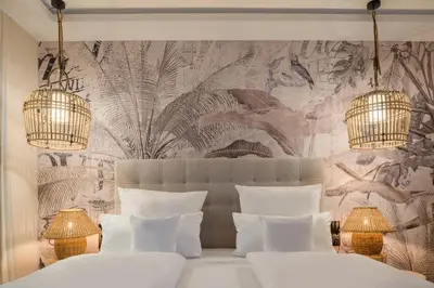 Ein Bett oder Betten in einem Zimmer der Unterkunft Das Oswald's Boutique Hotel