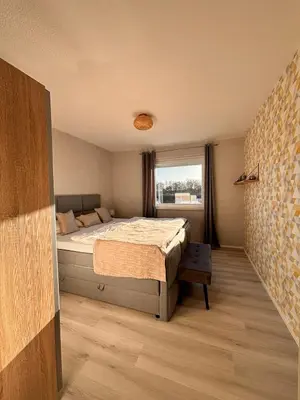 Ein Bett oder Betten in einem Zimmer der Unterkunft Haus Poseidon, Ferienwohnung POS20