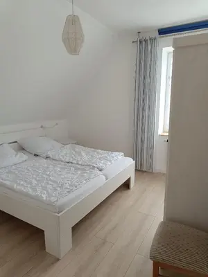 Ein Bett oder Betten in einem Zimmer der Unterkunft Küstenhaus Duhnen - Ferienhaus mit Meerblick