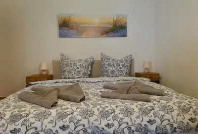 Ein Bett oder Betten in einem Zimmer der Unterkunft Strandgut