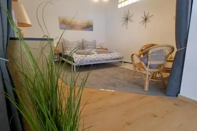 Ein Bett oder Betten in einem Zimmer der Unterkunft Strandgut