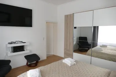 Ein Bett oder Betten in einem Zimmer der Unterkunft Kapitänshaus Schäfer App Kapitän
