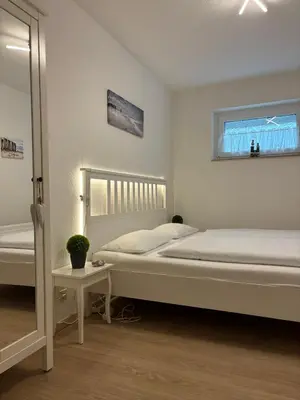 Ein Bett oder Betten in einem Zimmer der Unterkunft Haus Poseidon, Apartment POS03