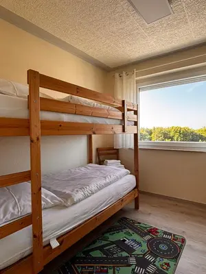 Ein Bett oder Betten in einem Zimmer der Unterkunft Haus Poseidon, Ferienwohnung POS31